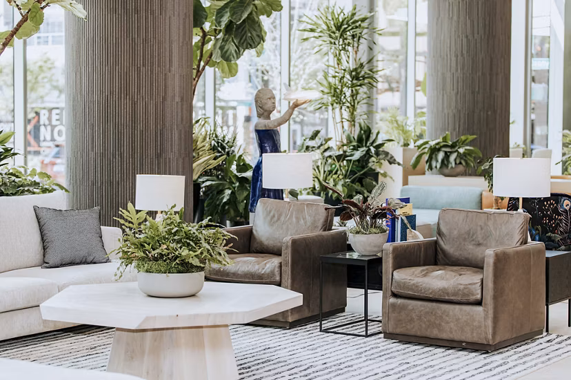 Clubhouse with modern decor and seating at REN Apartments