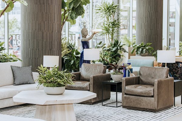 Clubhouse with modern decor and seating at REN Apartments