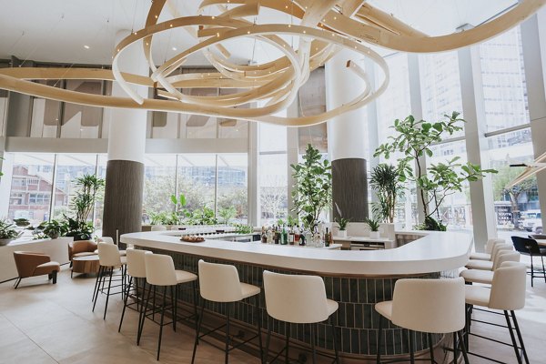 Clubhouse with modern furnishings and open design at REN Apartments in San Diego Ideal for social gatherings and tenant events