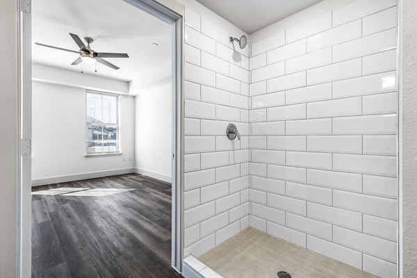 Modern bathroom with sleek fixtures at Nexus at Goodnight Ranch Apartments