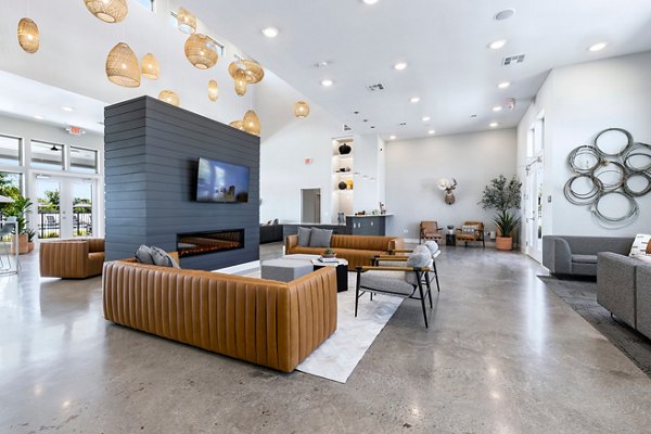 Clubhouse with modern decor and seating at Nexus at Goodnight Ranch Apartments
