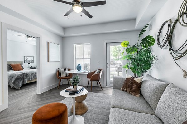 Spacious living room with modern decor at Nexus at Goodnight Ranch Apartments