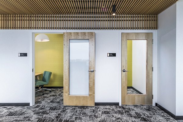 Clubhouse study area featuring modern seating and ample lighting at Union on Broadway Apartments luxury community