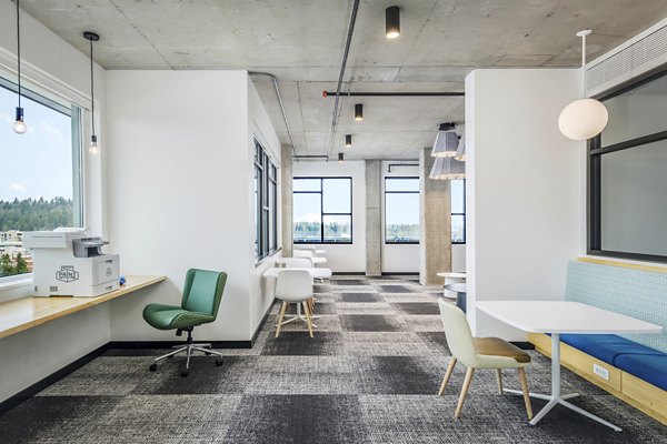 Modern study area in clubhouse at Union on Broadway Apartments with sleek furniture and ample natural light