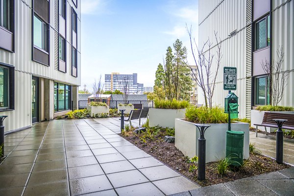 Dog-friendly outdoor dog park at Union on Broadway Apartments featuring agility equipment and open play spaces for residents' pets