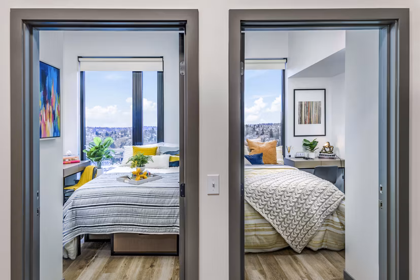 Bedroom with elegant furnishings and soft lighting at The Accolade Apartments