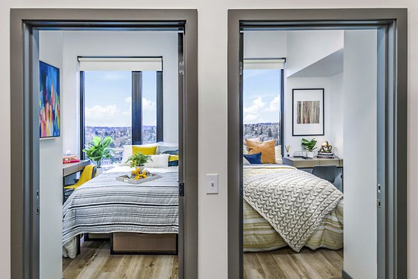 Bedroom with elegant furnishings and soft lighting at The Accolade Apartments