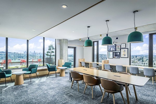Clubhouse study area with modern furniture and bright lighting at The Accolade Apartments Perfect for focused work and community gatherings