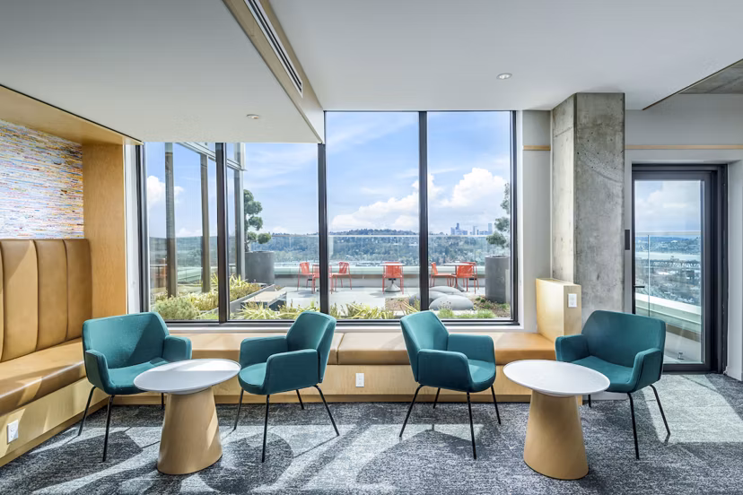 Clubhouse study area with modern decor and cozy seating at The Accolade Apartments