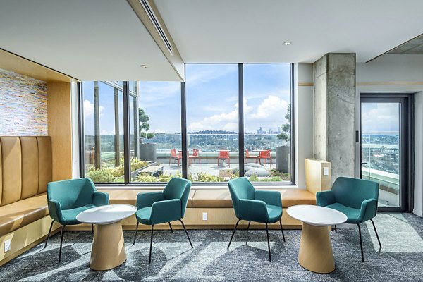 Clubhouse study area with modern decor and cozy seating at The Accolade Apartments