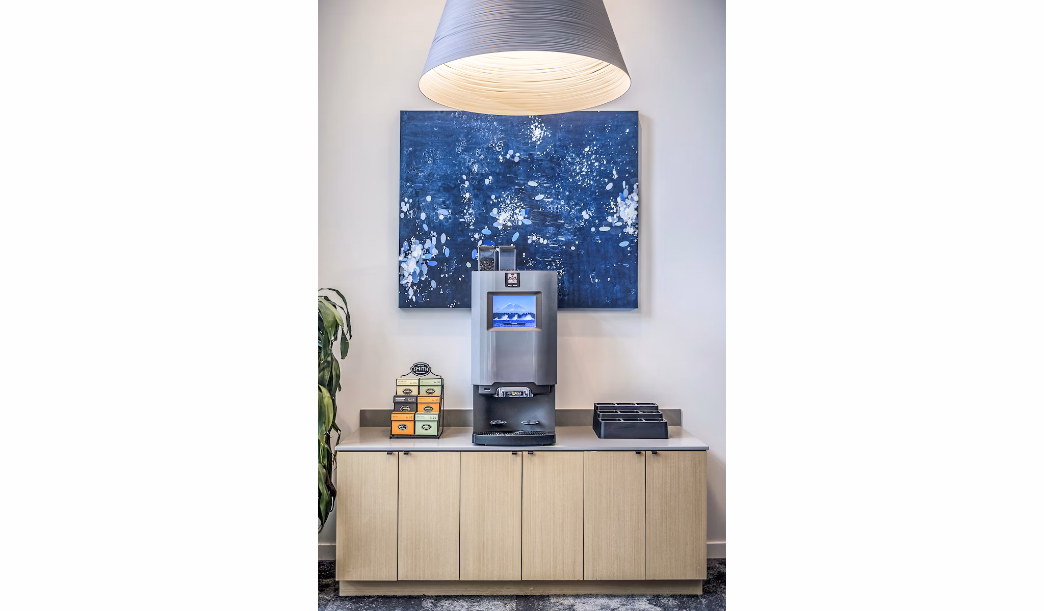 Clubhouse beverage area with sleek countertops and modern seating at The Accolade Apartments