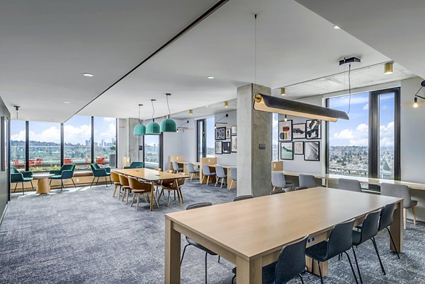 Clubhouse study area featuring modern design and comfortable seating at The Accolade Apartments, ideal for productive work or casual gatherings