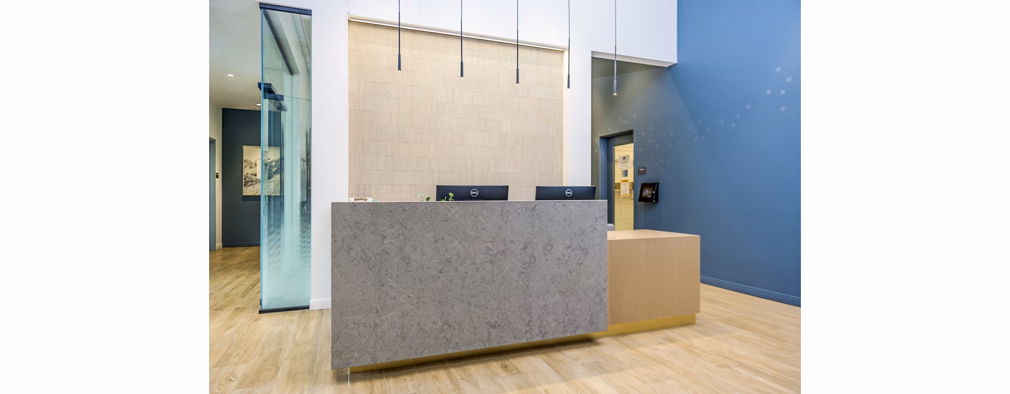 The Accolade: Luxurious clubhouse lobby with modern front desk at The Accolade Apartments in vibrant urban setting