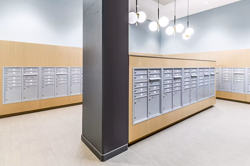 Modern mail room with secure package lockers at The Accolade Apartments