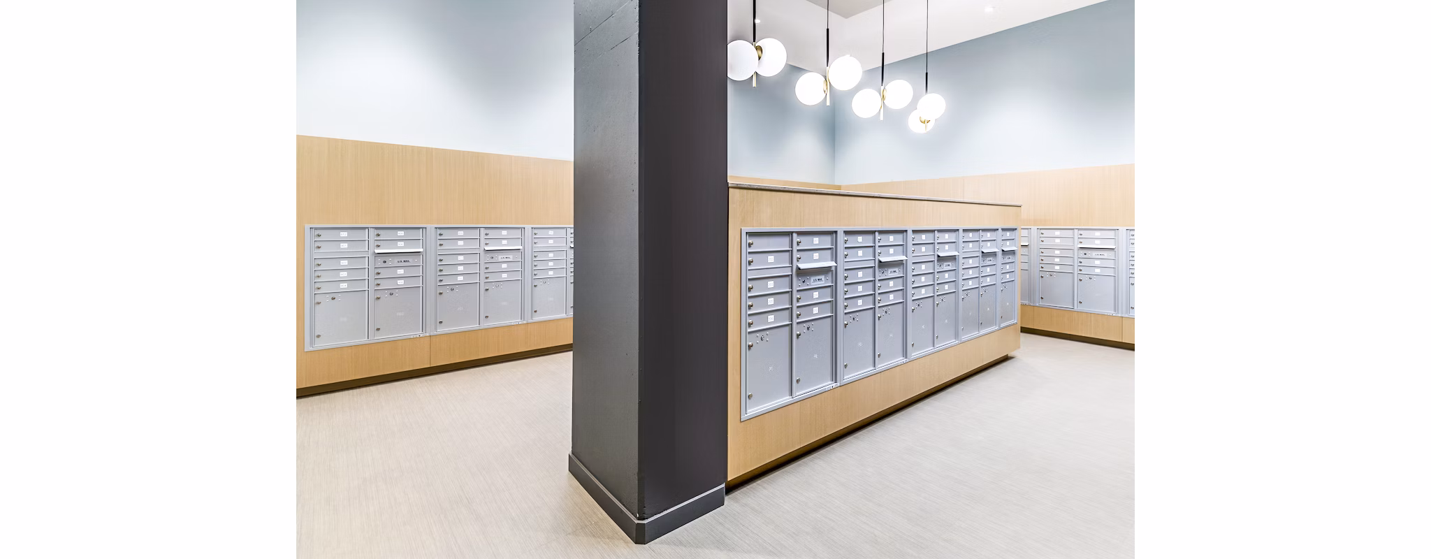 Modern mail room with secure package lockers at The Accolade Apartments