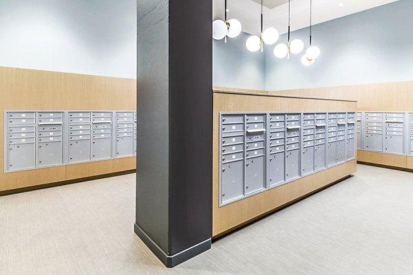 Modern mail room with secure package lockers at The Accolade Apartments