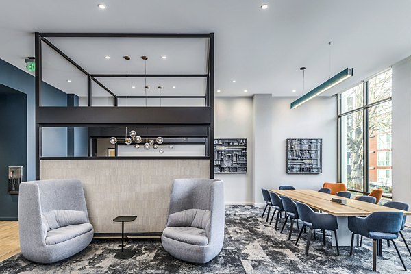 Clubhouse lobby featuring modern seating and natural light at The Accolade Apartments