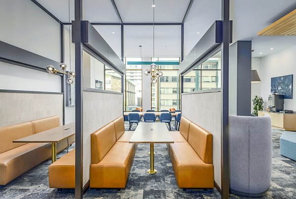 The Accolade Apartments: Stylish clubhouse/lobby featuring elegant seating and modern design