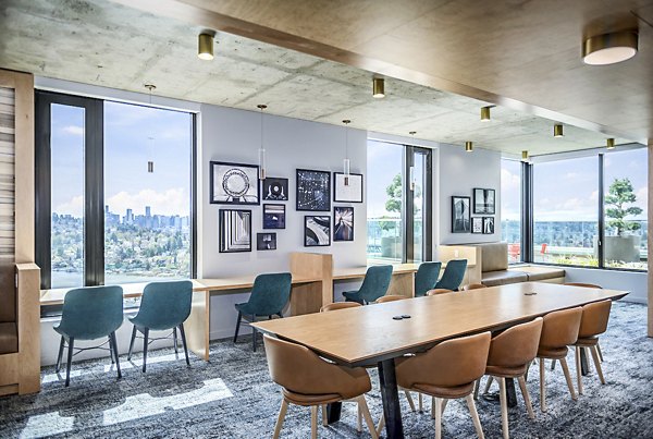 Study area with plush seating and state-of-the-art amenities at The Accolade Apartments' clubhouse
