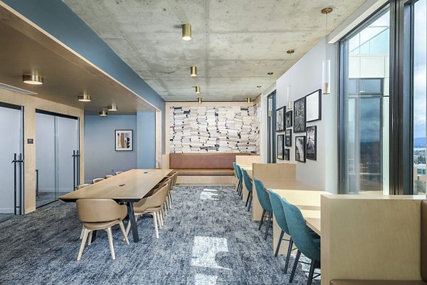 Cozy clubhouse study area with modern furnishings at The Accolade Apartments, ideal for student gatherings and collaborative learning spaces