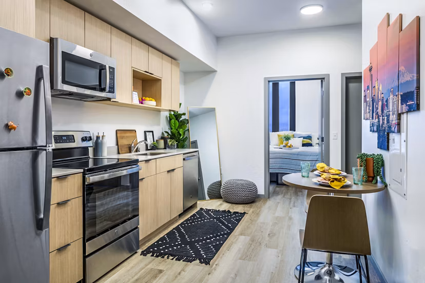 Modern kitchen with stainless steel appliances at The Accolade Apartments