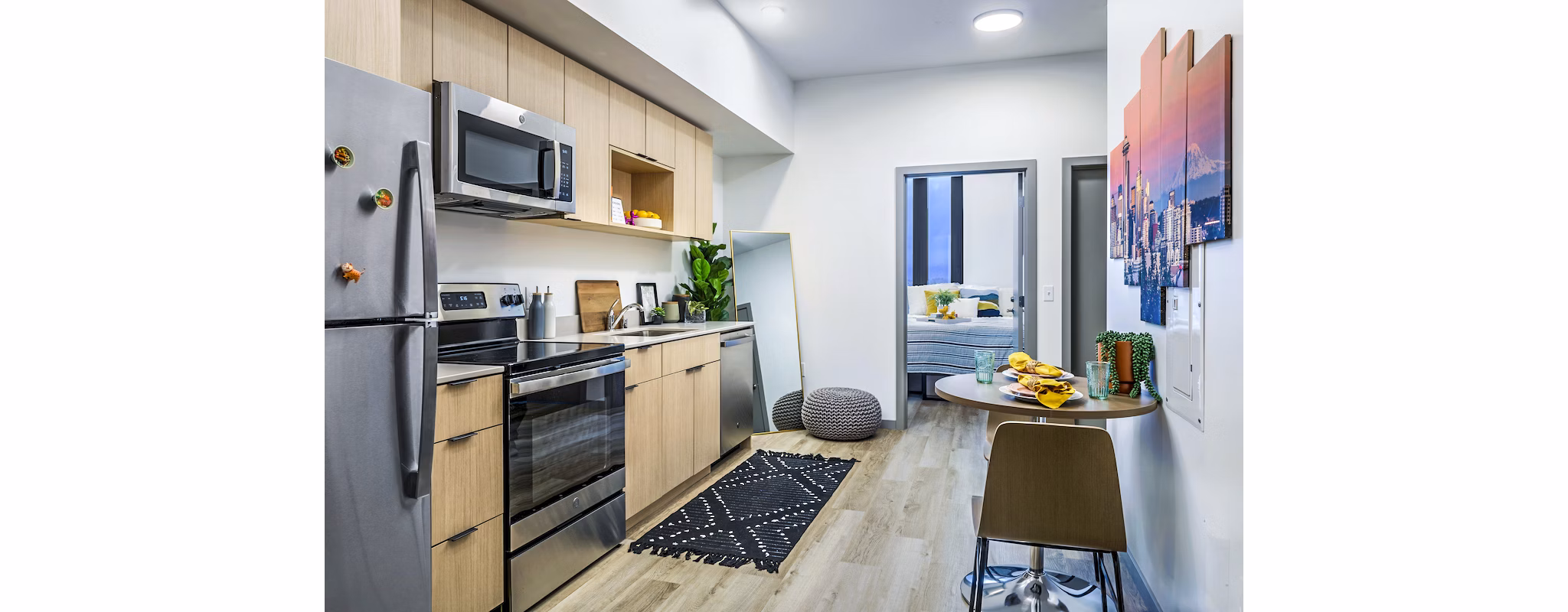 Modern kitchen with stainless steel appliances at The Accolade Apartments