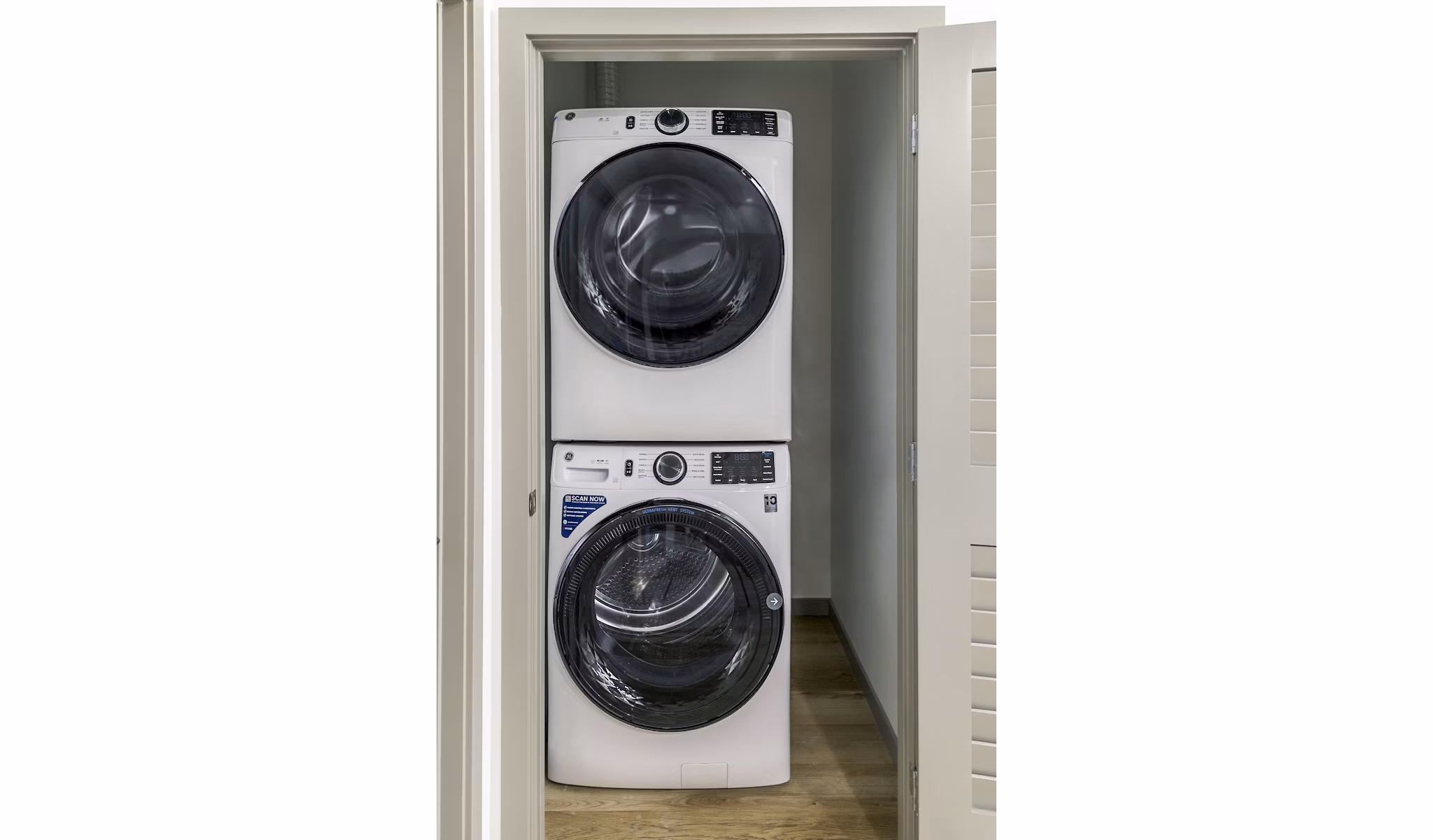 Laundry room with modern washers and dryers at The Accolade Apartments