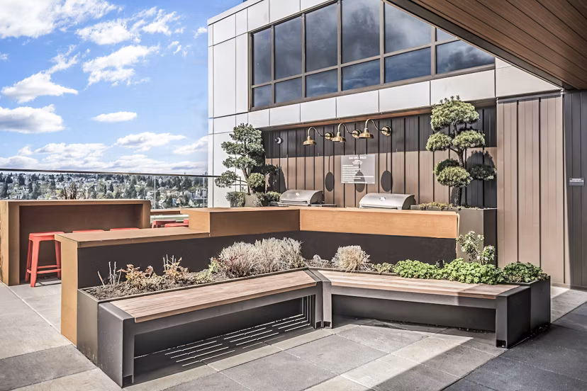 Modern outdoor grill area with sleek patio furnishings at The Accolade Apartments, perfect for entertaining and relaxation