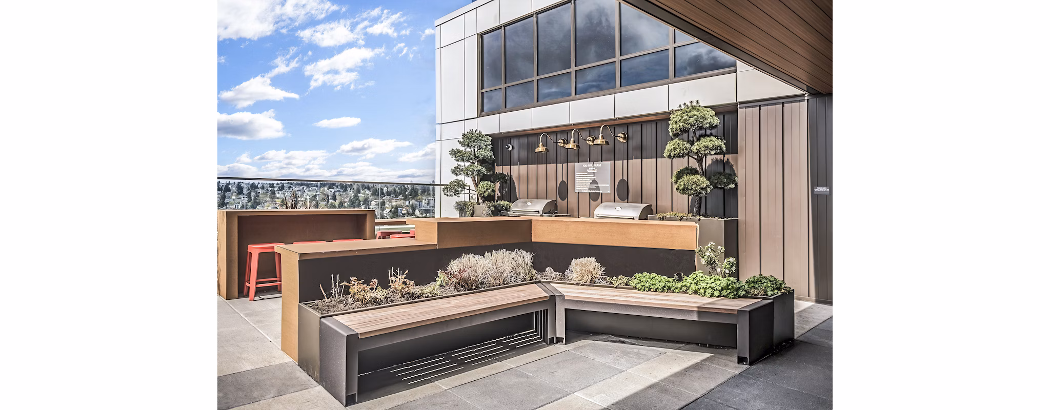 Modern outdoor grill area with sleek patio furnishings at The Accolade Apartments, perfect for entertaining and relaxation