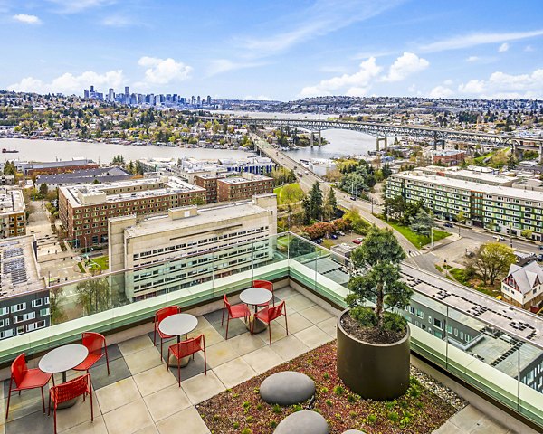 Private patio with outdoor seating at The Accolade Apartments offering serene views