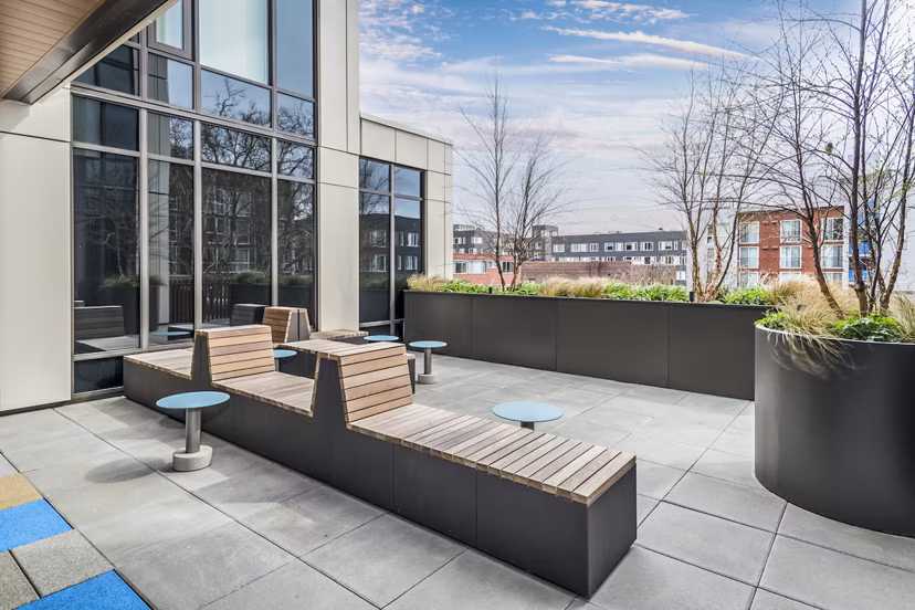 Spacious patio with modern furnishings at The Accolade Apartments, perfect for relaxing and enjoying outdoor views