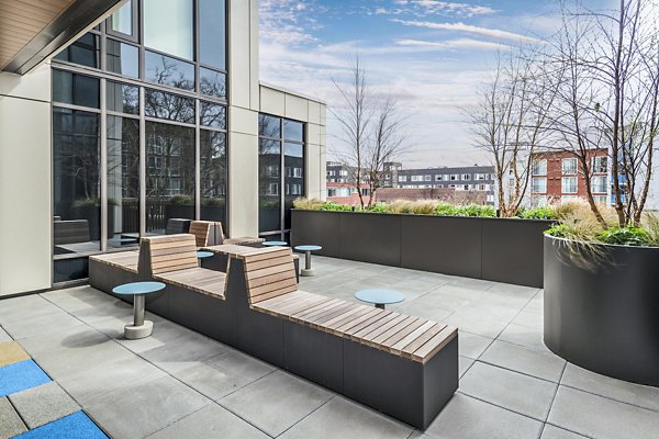 Spacious patio with modern furnishings at The Accolade Apartments, perfect for relaxing and enjoying outdoor views