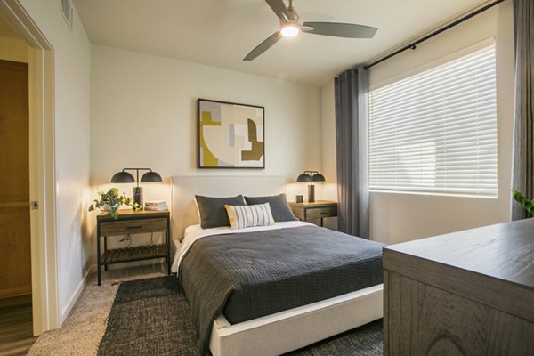 Cozy bedroom with modern decor at South Meadows Apartments
