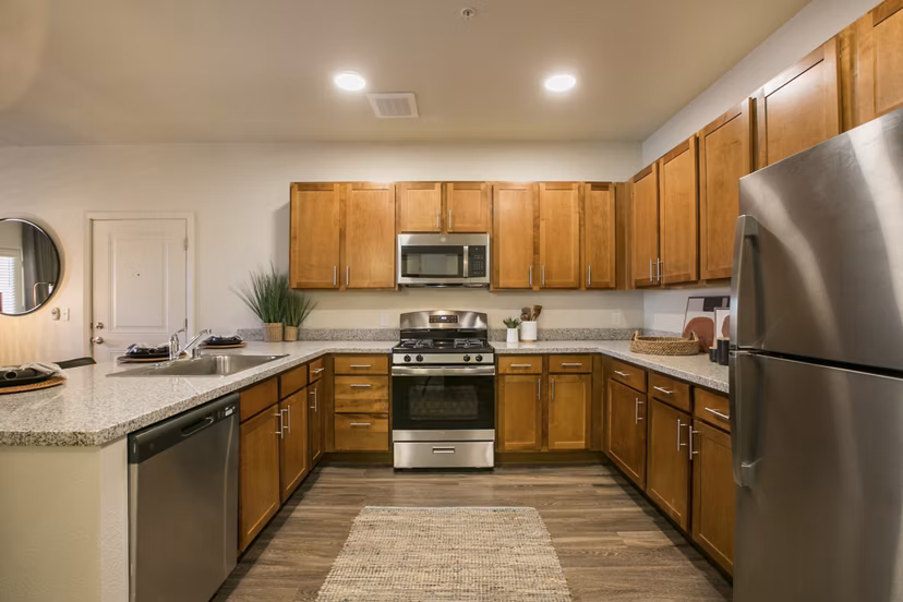 Modern kitchen with stainless steel appliances at South Meadows Apartments in Greystar luxury community