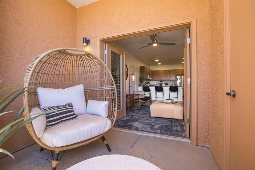 South Meadows Apartments: Cozy patio with seating and plants for relaxation