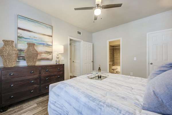 Spacious bedroom with modern decor and large windows in Preston Peak Apartments