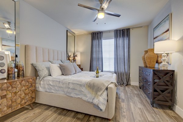 Cozy bedroom with modern decor and ample natural light at Preston Peak Apartments