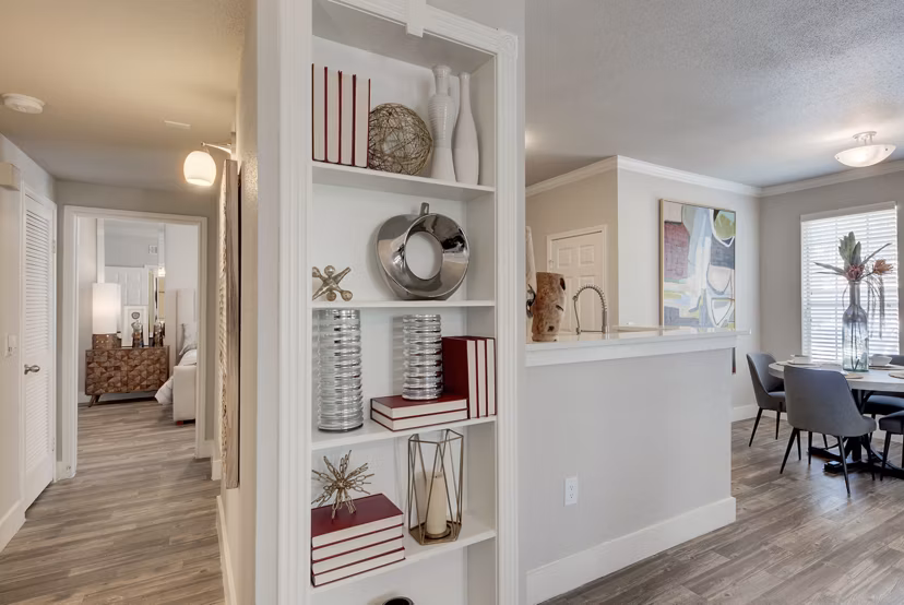 Hallway featuring modern lighting and carpeted floors in Preston Peak Apartments, luxury living with attention to detail
