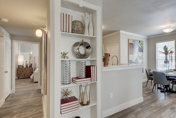 Hallway featuring modern lighting and carpeted floors in Preston Peak Apartments, luxury living with attention to detail