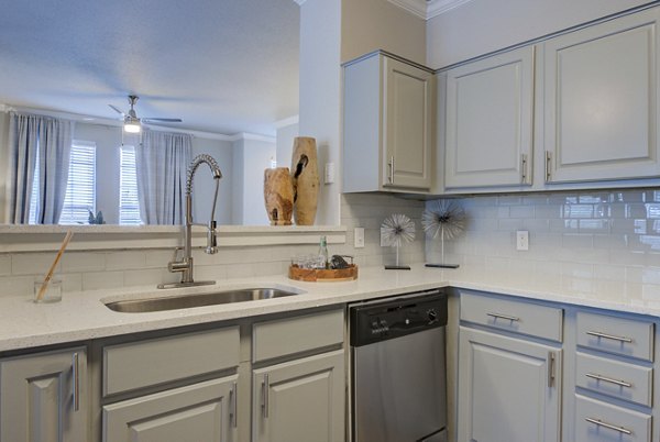 Modern kitchen with stainless steel appliances at Preston Peak Apartments