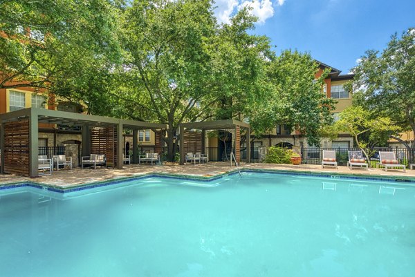 Resort-style pool at Preston Peak Apartments offering luxurious relaxation in a natural setting