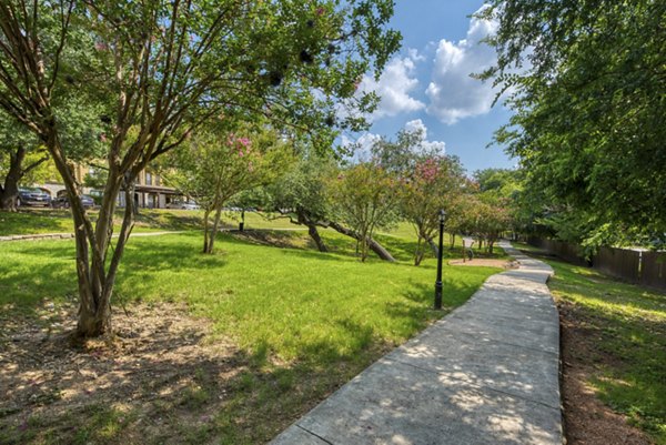 Elegant entrance view at Preston Peak Apartments, a luxury living community with modern amenities and scenic surroundings