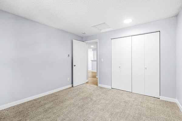 Cozy bedroom featuring modern furnishings at Avana West Hill Apartments, a Greystar luxury property in vibrant West Hill neighborhood