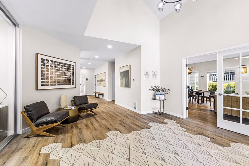 Clubhouse and leasing office at Avana West Hill Apartments featuring modern design and comfortable seating area