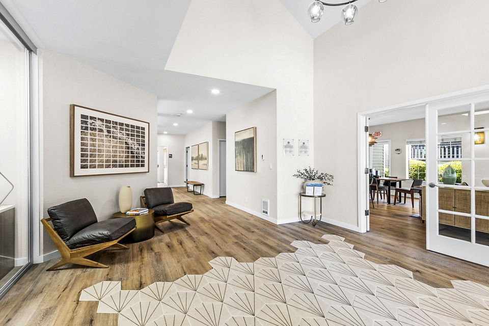 Clubhouse and leasing office at Avana West Hill Apartments featuring modern design and comfortable seating area