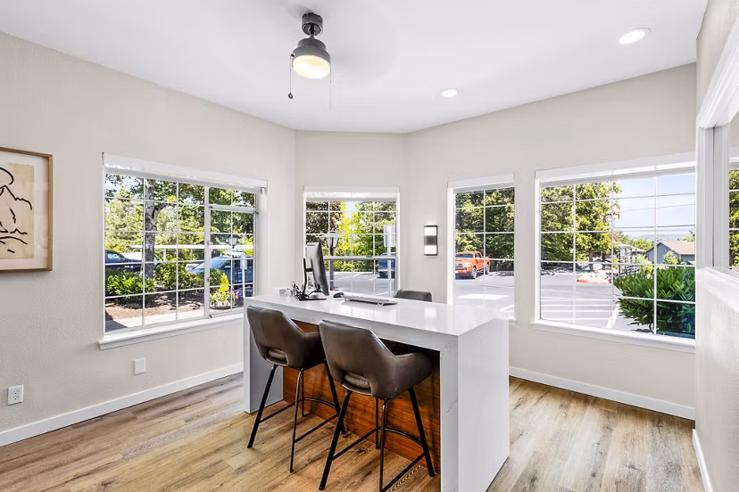 Clubhouse featuring modern design and high ceilings at Avana West Hill Apartments