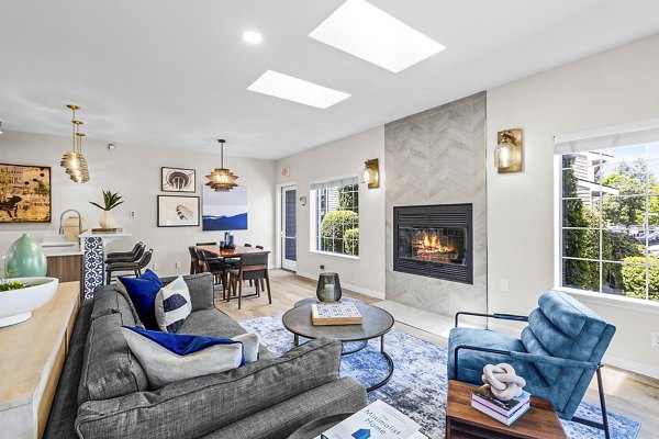 Clubhouse featuring stylish lounge seating and community kitchen at Avana West Hill Apartments