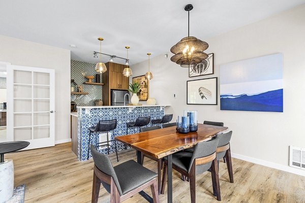 Clubhouse with modern seating and billiards table at Avana West Hill Apartments featuring luxury amenities for residents