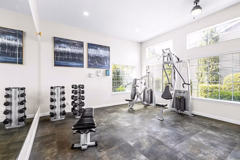 Fitness center with modern equipment at Avana West Hill Apartments