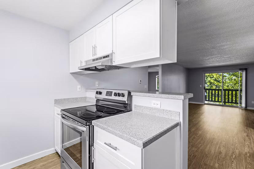 Modern kitchen with stainless steel appliances at Avana West Hill Apartments